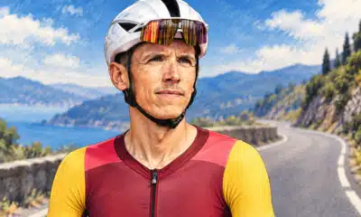 Illustrazione editoriale di un ciclista con casco davanti a una strada vuota.