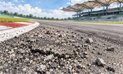 Illustrazione editoriale di un tratto di pista con asfalto scheggiato e frammenti sparsi sul fondo.
