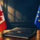 Illustrazione editoriale con le bandiere canadese ed europea ai lati di una cartella diplomatica chiusa.
